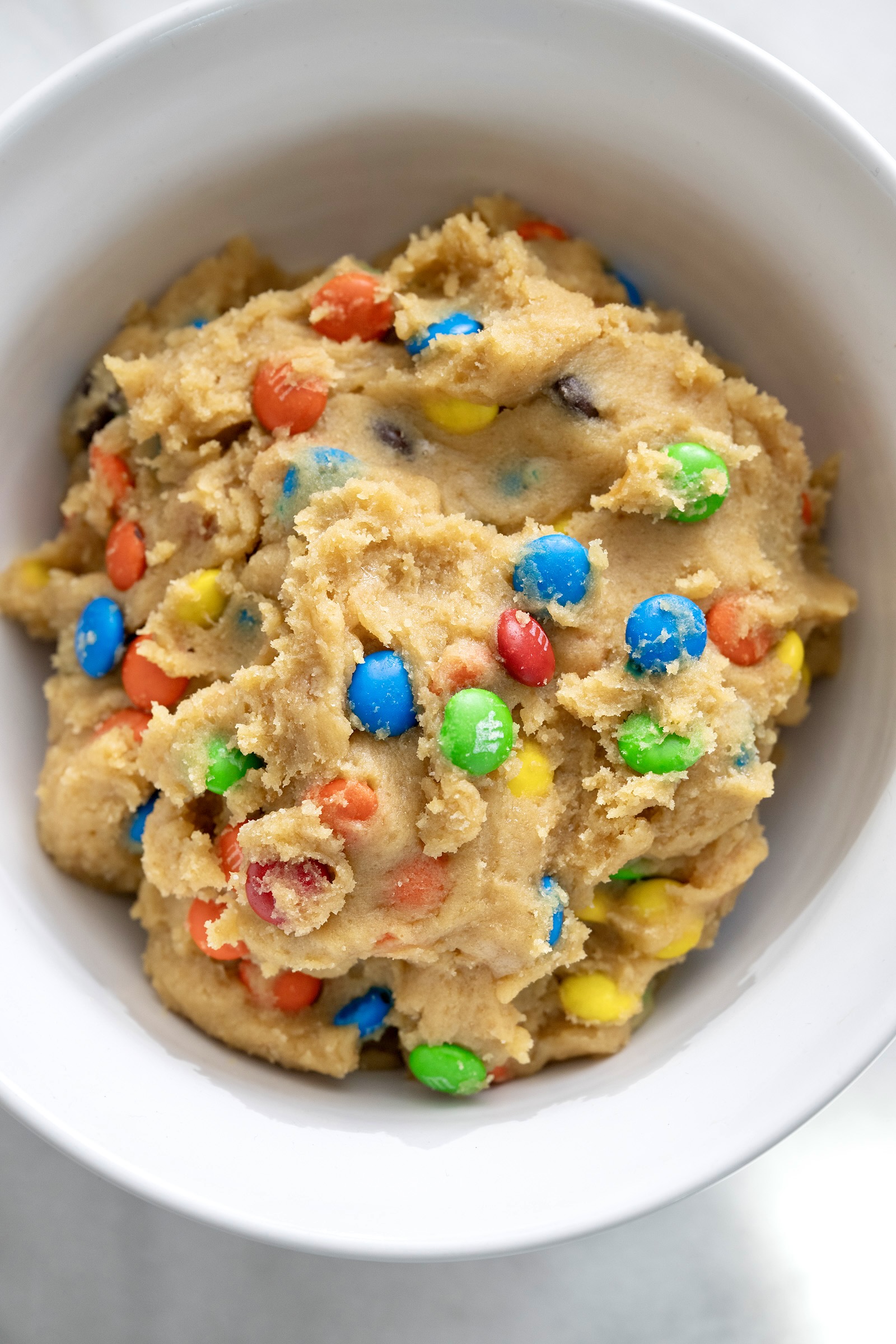 A popular holiday gift (for any holiday) and a great project for kids to make for friends, M&M Cookies in a Jar are fun to bake, give, and enjoy. Printable tags included!